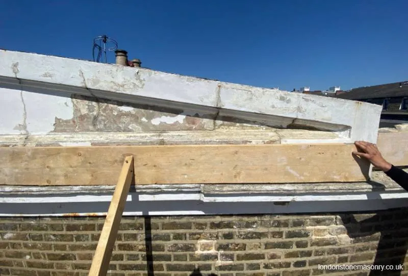 Damaged stone pediment London