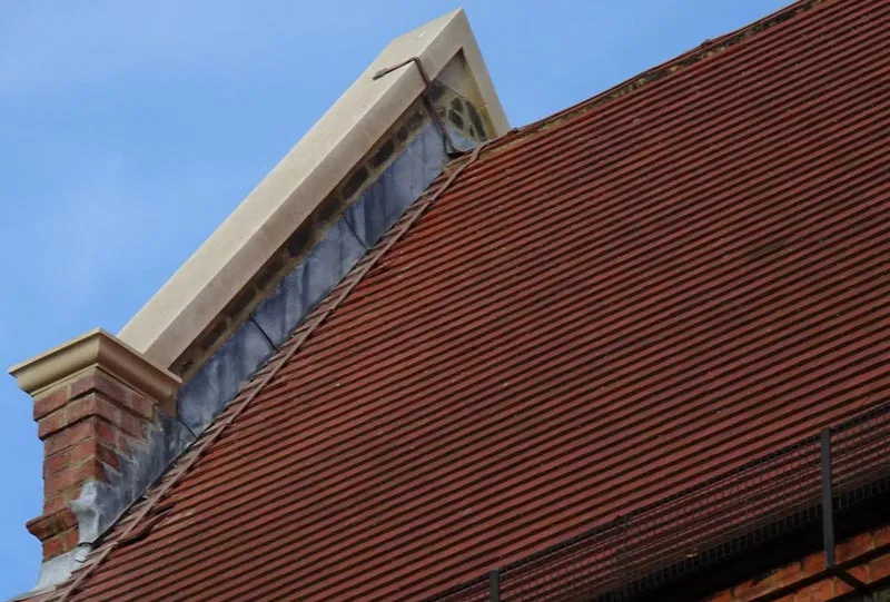 New coping stones on a gable wall London