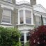 A new upper cast stone bay window in Hackney