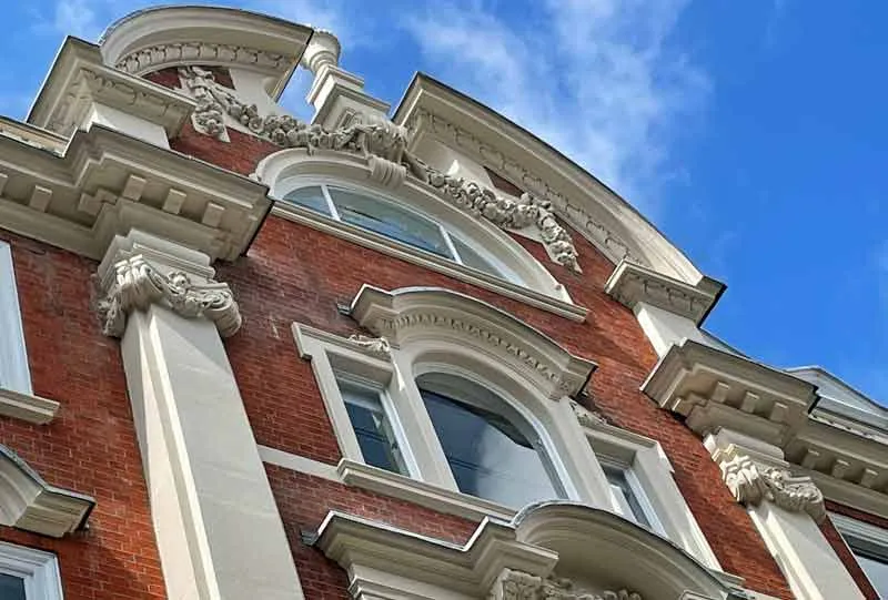 New stone pilaster capital in a London facade